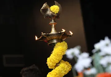 Marigold garlands and a trophy at the Inceptra college fest